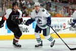PHILADELPHIA - DECEMBER 03:  Rick Rypien #37 of the Vancouver Canucks skates against Dan Carcillo #13 of the Philadelphia Flyers on December 3, 2009 at Wachovia Center in Philadelphia, Pennsylvania. The Canucks defeated the Flyers 3-0.  (Photo by Jim McIsaac/Getty Images)