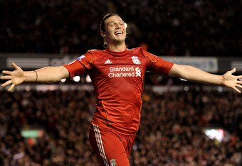 LIVERPOOL, ENGLAND - APRIL 11:  Andy Carroll of Liverpool celebrates scoring his team's third goal during the Barclays Premier League match between Liverpool and Manchester City at Anfield on April 11, 2011 in Liverpool, England.  (Photo by Michael Regan/Getty Images)