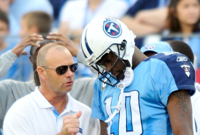 NASHVILLE, TN - NOVEMBER 21:  Quarterback Vince Young #11 of the Tennessee Titans talks with a member of the training staff after leaving a game against the Washington Redskins at LP Field on November 21, 2010 in Nashville, Tennessee. The Redskins won 19-16 in overtime.  (Photo by Grant Halverson/Getty Images)