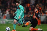 DONETSK, UKRAINE - APRIL 12:  Lionel Messi of Barcelona battles with Yoroslav Rakitskiy of Shakhtar Donetsk during the UEFA Champions League Quarter Final 2nd Leg match between Shakhtar Donetsk and Barcelona at the Donbass Arena on April 12, 2011 in Donetsk, Ukraine.  (Photo by Laurence Griffiths/Getty Images)