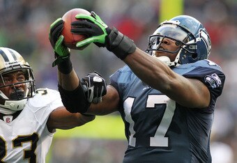 SEATTLE, WA - JANUARY 08:  Mike Williams #17 of the Seattle Seahawks completes a reception over Jabari Greer #33 of the New Orleans Saints during the 2011 NFC wild-card playoff game at Qwest Field on January 8, 2011 in Seattle, Washington.  (Photo by Jonathan Ferrey/Getty Images)