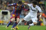 BARCELONA, SPAIN - NOVEMBER 29:  Lionel Messi of Barcelona (L) takes the ball past Marcelo Vieira of Real Madrid during the La Liga match between Barcelona and Real Madrid at the Camp Nou Stadium on November 29, 2010 in Barcelona, Spain.  Barcelona won the match 5-0. (Photo by David Ramos/Getty Images)
