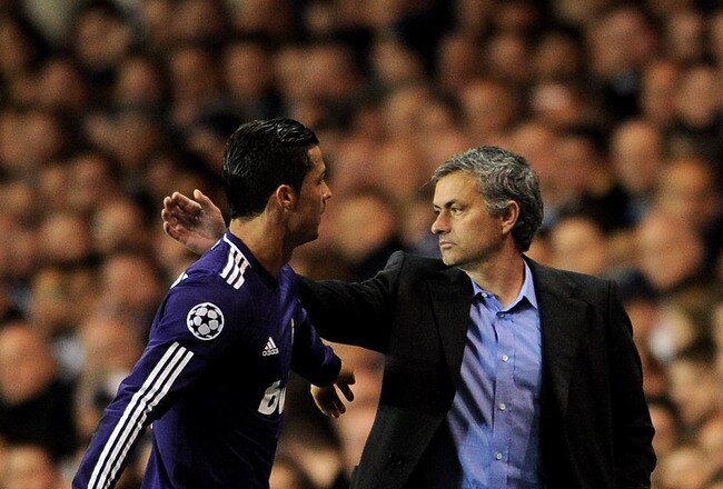 LONDON, ENGLAND - APRIL 13: Manager Jose Mourinho congratulates Cristiano Ronaldo of Real Madrid as he leaves the pitch during the UEFA Champions League quarter final second leg match between Tottenham Hotspur and Real Madrid at White Hart Lane on April 13, 2011 in London, England.  (Photo by Jasper Juinen/Getty Images)