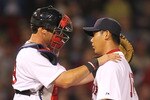 BOSTON, MA - APRIL 11:  Jarrod Saltalamacchia #39 consoles Daisuke Matsuzaka #18 of the Boston Red Sox after a six-run second inning against the Tampa Bay Rays at Fenway Park April 11, 2011 in Boston, Massachusetts. (Photo by Jim Rogash/Getty Images)