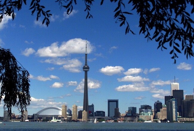 391776 02: (FILE PHOTO) The CN Tower and the Skydome highlight the Toronto skyline in his undated file photo. The International Olympic Committee (IOC) meets in Moscow July 13, 2001 to decide between front runners Beijing, Paris and Toronto for the site of the 2008 summer Olympics. (Photo by Carlo Allegri/Getty Images)