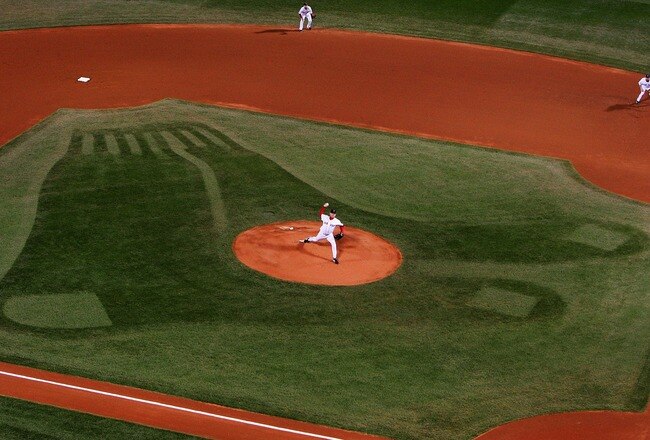 BOSTON - OCTOBER 13:  Starting pitcher Curt Schilling #38 of the Boston Red Sox pitches during Game Two of the American League Championship Series against the Cleveland Indians at Fenway Park on October 13, 2007 in Boston, Massachusetts.  (Photo by Al Bello/Getty Images)