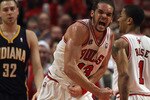 CHICAGO, IL - APRIL 16: Joakim Noah #13 of the Chicago Bulls celebrates two blocked shots in the final seconds against the Indiana Pacers in Game One of the Eastern Conference Quarterfinals in the 2011 NBA Playoffs at the United Center on April 16, 2011 in Chicago, Illinois. The Bulls defeated the Pacers 104-99. NOTE TO USER: User expressly acknowledges and agrees that, by downloading and/or using this photograph, User is consenting to the terms and conditions of the Getty Images License Agreement. (Photo by Jonathan Daniel/Getty Images)