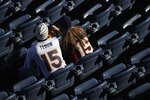 DENVER - DECEMBER 26:  Fans wearing Tim Tebow jersies begin to occupy the empty seats prior to the game as the Denver Broncos host the Houston Texas at INVESCO Field at Mile High on December 26, 2010 in Denver, Colorado. The Broncos defeated the Texans 24-23.  (Photo by Doug Pensinger/Getty Images)