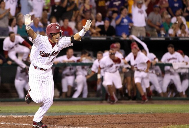OMAHA, NE - JUNE 29:  Whit Merrifield #5 of the South Carolina Gamecocks celebrates after hitting the game winning RBI to defeat the UCLA Bruins in game 2 of the men's 2010 NCAA College Baseball World Series at Rosenblatt Stadium on June 29, 2010 in Omaha, Nebraska. The Gamecocks defeated the Bruins 2-1 in eleven innings to win the National Championship.  (Photo by Christian Petersen/Getty Images)