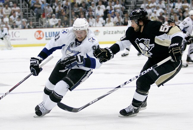 PITTSBURGH, PA - APRIL 15:  Steven Stamkos#91 of the Tampa Bay Lightning controls the puck as Kris Letang #58 of the Pittsburgh Penguins defends during Game Two of the Eastern Conference Quarterfinals during the 2011 NHL Stanley Cup Playoffs at Consol Energy Center on April 15, 2011 in Pittsburgh, Pennsylvania.  (Photo by Justin K. Aller/Getty Images)