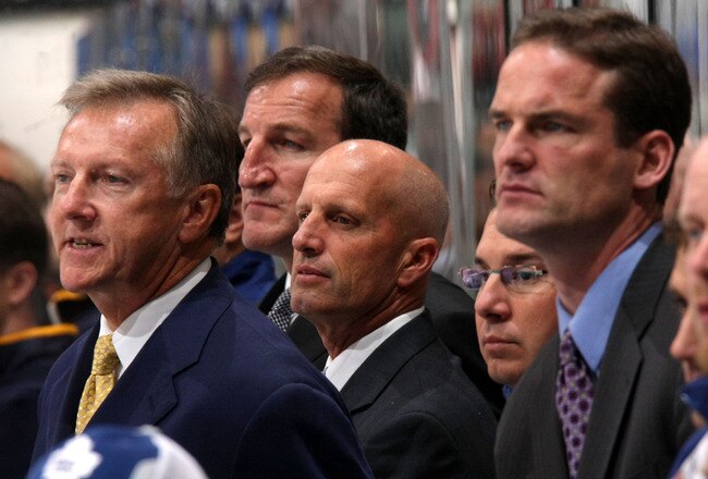 TORONTO - SEPTEMBER 22:  Members of the Toronto Maple Leafs coaching staff look on during action against the Buffalo Sabres in a preseason NHL game at the Air Canada Centre September 22, 2008 in Toronto, Ontario, Canada. They are: (L-R) head coach Ron Wilson and  assistant coaches Tim Hunter, Keith Acton and Ro Zettler.  (Photo By Dave Sandford/Getty Images)