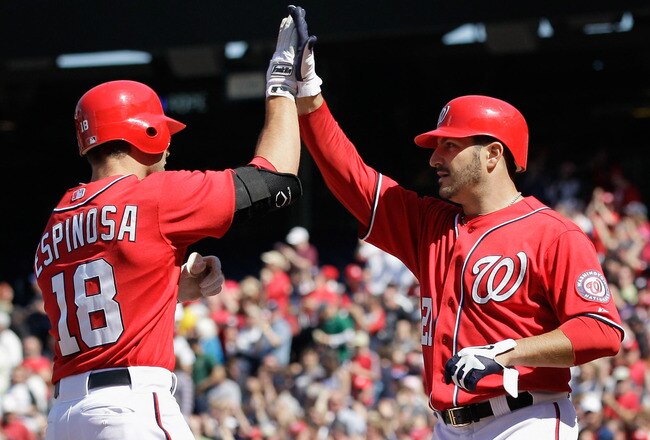 WASHINGTON, DC - APRIL 17:  Danny Espinosa #18 of the Washington Nationals celebrates with pitcher Jason Marquis #21 after Espinosa hit a three run home run during the fifth inning against the Milwaukee Brewers during the first game of a doubleheader at Nationals Park on April 17, 2011 in Washington, DC.  (Photo by Rob Carr/Getty Images)
