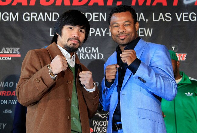 NEW YORK, NY - FEBRUARY 14:  Manny Pacquiao (L) and Shane Mosley pose for photographs to promote their upcoming fight at The Lighthouse at Chelsea Piers on February 14, 2011 in New York City.  (Photo by Chris Trotman/Getty Images)