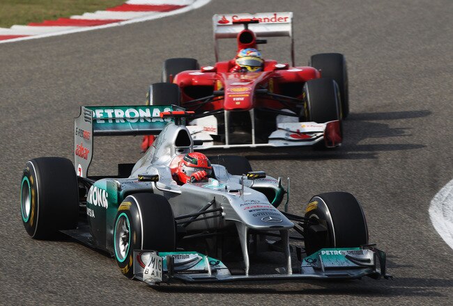 SHANGHAI, CHINA - APRIL 17:  Michael Schumacher of Germany and Mercedes GP leads from Fernando Alonso of Spain and Ferrari during the Chinese Formula One Grand Prix at the Shanghai International Circuit on April 17, 2011 in Shanghai, China.  (Photo by Mark Thompson/Getty Images)