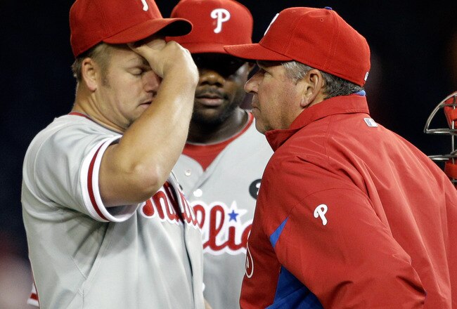 WASHINGTON, DC - APRIL 12:  Starting pitcher Joe Blanton #56 of the Philadelphia Phillies (L) talks with pitching coach Rich Dubee (R) during the fourth inning against the Washington Nationals at Nationals Park on April 12, 2011 in Washington, DC.  (Photo by Rob Carr/Getty Images)