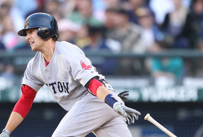 SEATTLE - JULY 23:  Jed Lowrie #12 of the Boston Red Sox singles in the fourth inning against the Seattle Mariners at Safeco Field on July 23, 2010 in Seattle, Washington. (Photo by Otto Greule Jr/Getty Images)