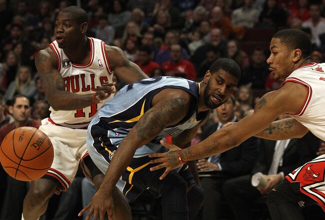 CHICAGO, IL - MARCH 25: O.J. Mayo #32 of the Memphis Grizzlies looses control of the ball under pressure from Ronnie Brewer #11 (L) and Derrick Rose #1 of the Chicago Bulls at the United Center on March 25, 2011 in Chicago, Illinois. The Bulls defeated the Grizzlies 99-96. NOTE TO USER: User expressly acknowledges and agrees that, by downloading and/or using this photograph, User is consenting to the terms and conditions of the Getty Images License Agreement. (Photo by Jonathan Daniel/Getty Images)