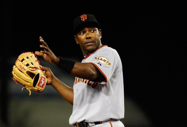 LOS ANGELES, CA - MARCH 31:  Miguel Tejada #10 of the San Francisco Giants signals against the Los Angeles Dodgers during their game on Opening Day at Dodger Stadium on March 31, 2011 in Los Angeles, California.  (Photo by Kevork Djansezian/Getty Images)