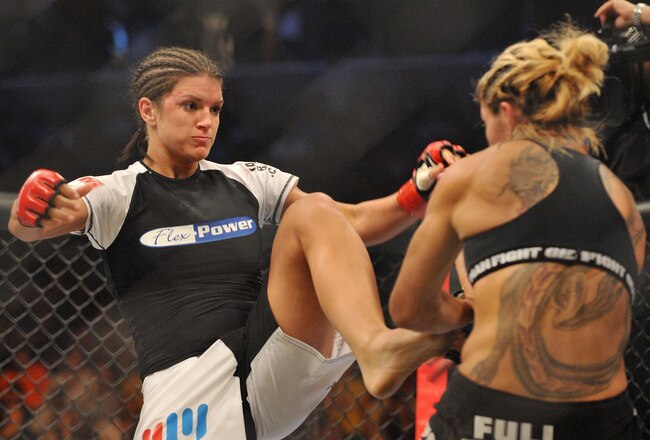 SAN JOSE, CA - AUGUST 15:  Cris Cyborg (R) battles Gina Carano during their Middleweight Championship fight at Stikeforce: Carano vs. Cyborg on August 15, 2009 in San Jose, California.  (Photo by Jon Kopaloff/Getty Images)