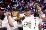 ARLINGTON, TX - FEBRUARY 06:  Aaron Rodgers #12 and Clay Matthews #52 of the Green Bay Packers of the Green Bay Packers holds the Lombardi Trophy after defeating the Pittsburgh Steelers 31-25 during Super Bowl XLV at Cowboys Stadium on February 6, 2011 in Arlington, Texas.  (Photo by Jamie Squire/Getty Images)
