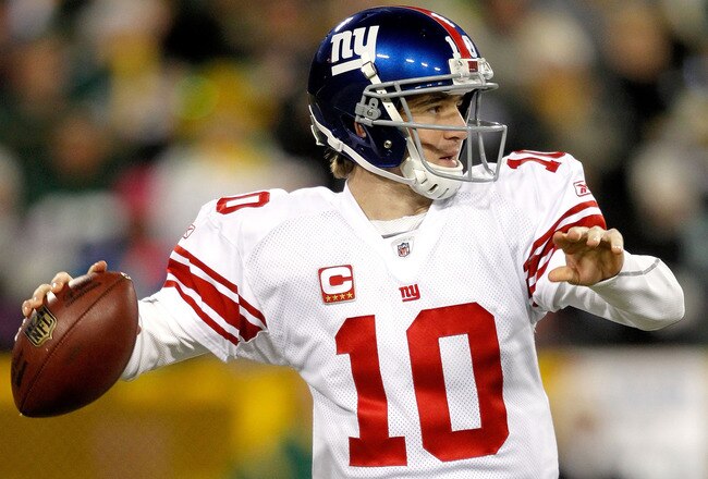 GREEN BAY, WI - DECEMBER 26:  Eli Manning #10 of the New York Giants throws against the Green Bay Packers at Lambeau Field on December 26, 2010 in Green Bay, Wisconsin.  (Photo by Matthew Stockman/Getty Images)