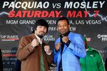 NEW YORK, NY - FEBRUARY 14:  Manny Pacquiao (L) and Shane Mosley pose for photographs to promote their upcoming fight at The Lighthouse at Chelsea Piers on February 14, 2011 in New York City.  (Photo by Chris Trotman/Getty Images)