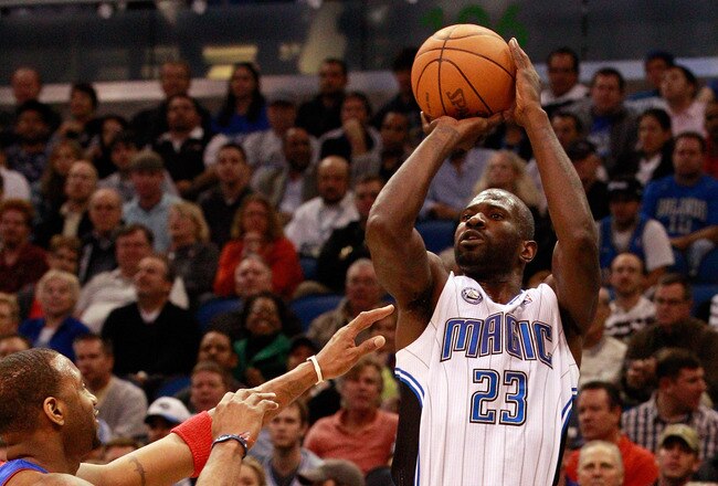 ORLANDO, FL - JANUARY 24:  Jason Richardson #23 of the Orlando Magic attempts a shot over Tracy McGrady #1 of the Detroit Pistons during the game at Amway Arena on January 24, 2011 in Orlando, Florida.  NOTE TO USER: User expressly acknowledges and agrees that, by downloading and or using this Photograph, user is consenting to the terms and conditions of the Getty Images License Agreement.  (Photo by Sam Greenwood/Getty Images)