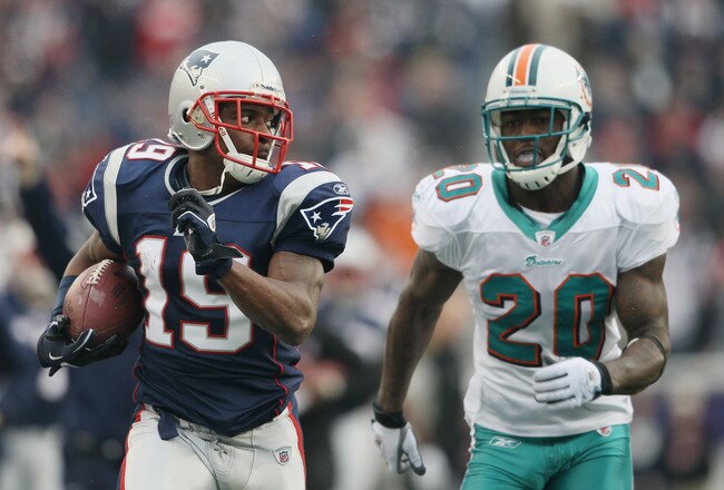 FOXBORO, MA - JANUARY 02:  Brandon Tate #19 of the New England Patriots carries the ball as Reshad Jones #20 of the Miami Dolphins chases after him on January 2, 2011 at Gillette Stadium in Foxboro, Massachusetts.  (Photo by Elsa/Getty Images)