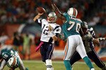 MIAMI - OCTOBER 04:  Quarterback Tom Brady #12 of the New England Patriots throws against the Miami Dolphins at Sun Life Stadium on October 4, 2010 in Miami, Florida.  (Photo by Marc Serota/Getty Images)