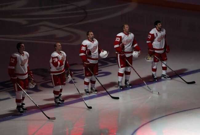 GLENDALE, AZ - APRIL 18:  (L-R) Jonathan Ericsson #52, Brian Rafalski #28, Tomas Holmstrom #96, Johan Franzen #93 and Pavel Datsyuk #13 of the Detroit Red Wings stand attended for the National Anthem before Game Three of the Western Conference Quarterfinals against the Phoenix Coyotes during the 2011 NHL Stanley Cup Playoffs at Jobing.com Arena on April 18, 2011 in Glendale, Arizona.  The Red Wings defeated the Coyotes 4-2.  (Photo by Christian Petersen/Getty Images)