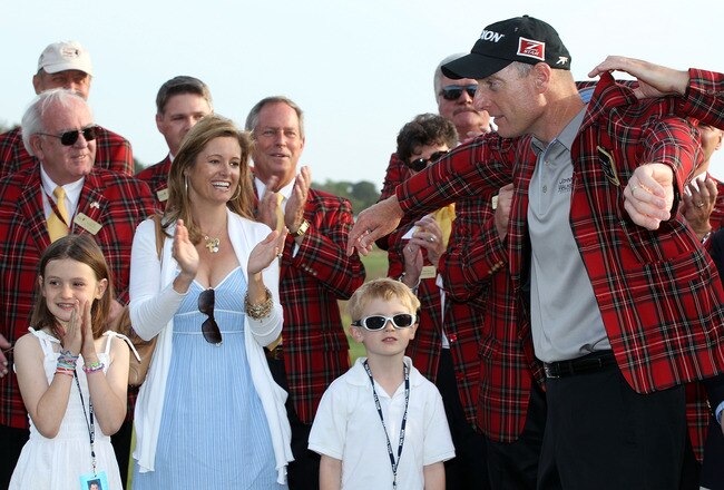 HILTON HEAD ISLAND, SC - APRIL 18:  Jim Furyk is fitted with the winner's jacket and celebrates with his wife Tabitha (C) son Tanner (R) and daughter Caleigh (L) after winning the 2010 Verizon Heritage at the Harbour Town Golf Links on April 18, 2010 in Hilton Head lsland, South Carolina.  (Photo by Scott Halleran/Getty Images)