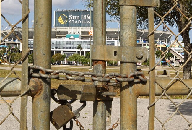 MIAMI GARDENS, FL - MARCH 03:  A view of Sun Life Stadium behind a locked gate as the NFL lockout looms on March 3, 2011 in Miami Gardens, Florida.  (Photo by Mike Ehrmann/Getty Images)