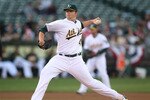 OAKLAND, CA - APRIL 2:  Brett Anderson #49 of the Oakland Athletics pitches against the Seattle Mariners during a Major League Baseball game at the Oakland-Alameda County Coliseum on April 2, 2011 in Oakland, California. (Photo by Jed Jacobsohn/Getty Images)