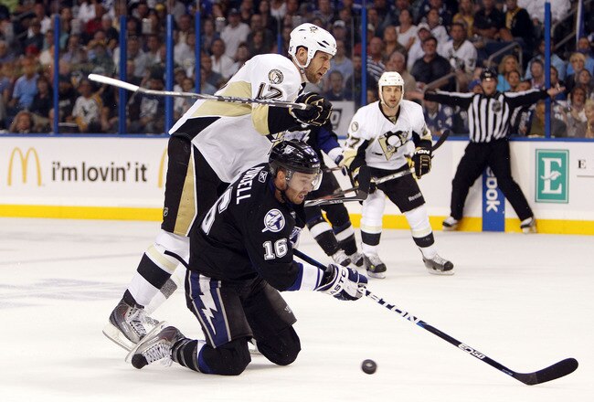 TAMPA, FL - APRIL 18: Teddy Purcell #16 of the Tampa Bay Lightning tangles with Michael Rupp #17 of the Pittsburgh Penguins in Game Three of the Eastern Conference Quarterfinals during the 2011 NHL Stanley Cup Playoffs at the St. Pete Times Forum on April 18, 2011 in Tampa, Florida. (Photo by Eliot J. Schechter/Getty Images)