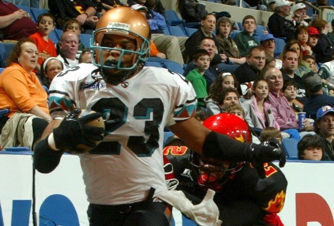 UNIONDALE, NY - APRIL 28: Trandon Harvey #23 of the Arizona Rattlers runs the ball in for a touchdown against Ifeanyi Ohalete #2 of the New York Dragons on April 28, 2007 at the Nassau Coliseum in Uniondale, New York. (Photo by Mike Stobe/Getty Images)