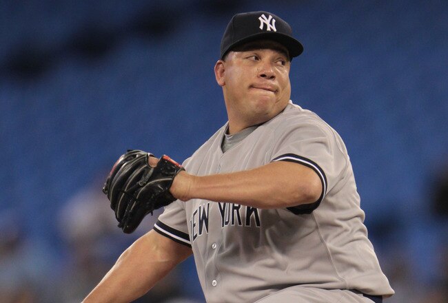 TORONTO, ON - APRIL 20:  Bartolo Colon #40 of the New York Yankees throws a pitch during their game against the Toronto Blue Jays at Rogers Centre on April 20, 2011 in Toronto, Canada.  (Photo by Scott Halleran/Getty Images)
