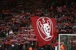 LIVERPOOL, UNITED KINGDOM - APRIL 08:  Supporters on the Kop show off their flags and scarves prior to the UEFA Champions League Quarter Final, second leg match between Liverpool and Arsenal at Anfield on April 8, 2008 in Liverpool, England.  (Photo by Clive Brunskill/Getty Images)