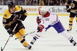 BOSTON, MA - MARCH 24:  Nathan Horton #18 of the Boston Bruins takes the puck as Jeff Halpern #15 of the Montreal Canadiens defends on March 24, 2011 at the TD Garden in Boston, Massachusetts.  (Photo by Elsa/Getty Images)