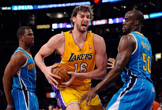 LOS ANGELES, CA - APRIL 20:  Pau Gasol #16 of the Los Angeles Lakers goes up for a shot against Emeka Okafor #50 of the New Orleans Hornets in Game Two of the Western Conference Quarterfinals in the 2011 NBA Playoffs on April 20, 2011 at Staples Center in Los Angeles, California. NOTE TO USER: User expressly acknowledges and agrees that, by downloading and or using this photograph, User is consenting to the terms and conditions of the Getty Images License Agreement.  (Photo by Kevork Djansezian/Getty Images)