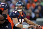 DENVER - JANUARY 02:  Quarterback Tim Tebow #15 of the Denver Broncos looks to deliver a pass behind the protection of offensive lineman Ryan Clady #78 as he blocks Antwan Barnes #98 of the San Diego Chargers at INVESCO Field at Mile High on January 2, 2011 in Denver, Colorado.  (Photo by Doug Pensinger/Getty Images)