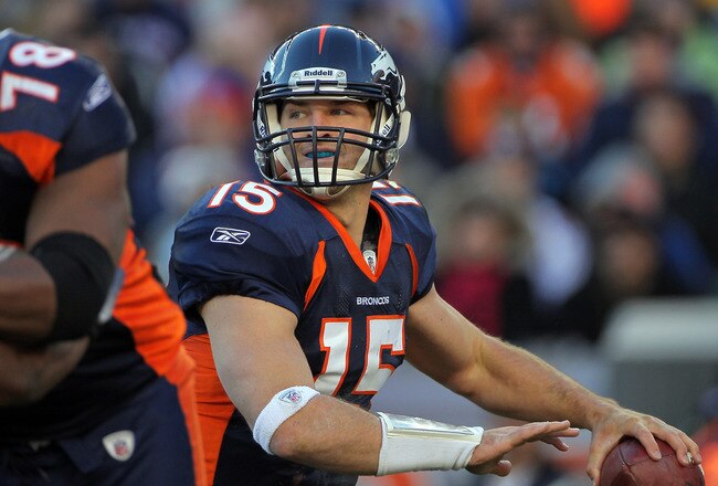DENVER - JANUARY 02:  Quarterback Tim Tebow #15 of the Denver Broncos looks to deliver a pass behind the protection of offensive lineman Ryan Clady #78 as he blocks Antwan Barnes #98 of the San Diego Chargers at INVESCO Field at Mile High on January 2, 2011 in Denver, Colorado.  (Photo by Doug Pensinger/Getty Images)