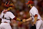 ST. LOUIS - JULY 15: Yadier Molina #4 and Mitchell Boggs #41 both of the St. Louis Cardinals congratulate each other after beating  the Los Angeles Dodgers at Busch Stadium on July 15, 2010 in St. Louis, Missouri.  The Cardinals beat the Dodgers 7-1.  (Photo by Dilip Vishwanat/Getty Images)