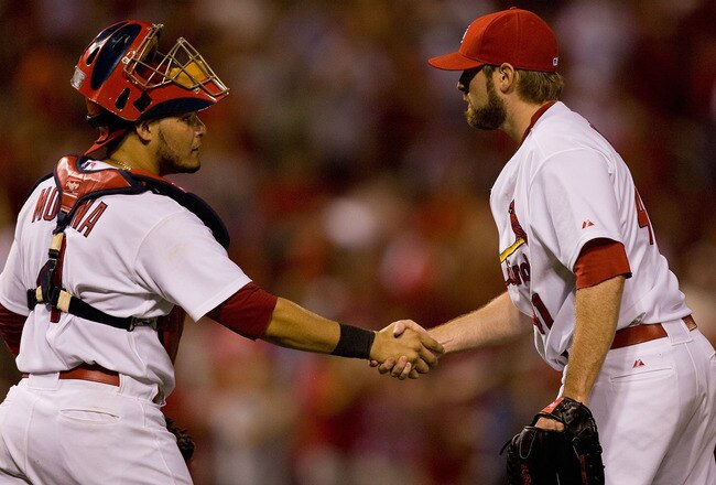 ST. LOUIS - JULY 15: Yadier Molina #4 and Mitchell Boggs #41 both of the St. Louis Cardinals congratulate each other after beating  the Los Angeles Dodgers at Busch Stadium on July 15, 2010 in St. Louis, Missouri.  The Cardinals beat the Dodgers 7-1.  (Photo by Dilip Vishwanat/Getty Images)