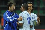 MILAN, ITALY - APRIL 05:  Raul (L), Jefferson Farfan (C) and Ali Karimi of Schalke 04 celebrate victory at the end of the UEFA Champions League Quarter Final match between FC Internazionale Milano and Schalke 04 at San Siro Stadium on April 5, 2011 in Milan, Italy.  (Photo by Valerio Pennicino/Getty Images)
