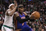 BOSTON, MA - APRIL 17:  Carmelo Anthony #7 of the New York Knicks heads for the net as Paul Pierce #34 of the Boston Celtics defends in Game One of the Eastern Conference Quarterfinals in the 2011 NBA Playoffs on April 17, 2011 at the TD Garden in Boston, Massachusetts. The Boston Celtics defeated the New York Knicks 87-85. NOTE TO USER: User expressly acknowledges and agrees that, by downloading and or using this photograph, User is consenting to the terms and conditions of the Getty Images License Agreement.  (Photo by Elsa/Getty Images)