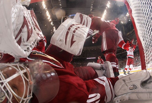 GLENDALE, AZ - APRIL 20:  Goaltender Ilya Bryzgalov #30 of the Phoenix Coyotes falls into the net after allowing a third period goal to Daniel Cleary (not pictured) of the Detroit Red Wings in Game Four of the Western Conference Quarterfinals during the 2011 NHL Stanley Cup Playoffs at Jobing.com Arena on April 20, 2011 in Glendale, Arizona.  The Red Wings defeated the Coyotes 6-3 to win the series 4-0. (Photo by Christian Petersen/Getty Images)