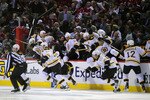 MONTREAL, QC - APRIL 21:  The Boston Bruins bench explodes onto the ice after defeating the Montreal Canadiens in overtime during Game Four of the Eastern Conference Quarterfinals during the 2011 NHL Stanley Cup Playoffs at the Bell Centre on April 21, 2011 in Montreal, Canada.  (Photo by Phillip MacCallum/Getty Images)