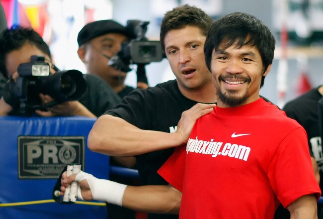 HOLLYWOOD, CA - APRIL 20:  Manny Pacquiao (R) of the Philippines trains with strength coach Alex Ariza (L) during a media workout at the Wild Card Boxing Club on April 20, 2011 in Hollywood, California.  (Photo by Jeff Gross/Getty Images)