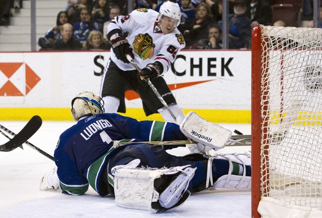 VANCOUVER, CANADA - FEBRUARY 4: Goalie Roberto Luongo #1 of the Vancouver Canucks sprawls and watches Tomas Kopecky #82 of the Chicago Blackhawks hit the post with his shot during the third period in NHL action on February 04, 2011 at Rogers Arena in Vancouver, British Columbia, Canada. (Photo by Rich Lam/Getty Images)
