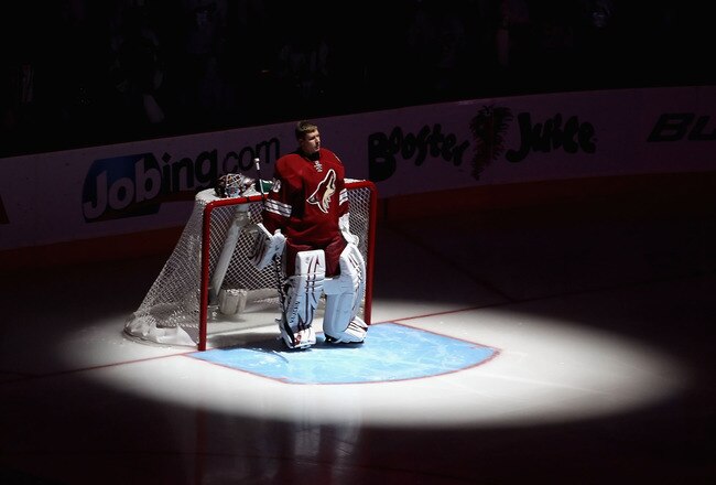 GLENDALE, AZ - APRIL 20:  Goaltender Ilya Bryzgalov #30 of the Phoenix Coyotes stands attended for the National Anthem before Game Four of the Western Conference Quarterfinals against the Detroit Red Wings during the 2011 NHL Stanley Cup Playoffs at Jobing.com Arena on April 20, 2011 in Glendale, Arizona.  The Red Wings defeated the Coyotes 6-3 to win the series 4-0.  (Photo by Christian Petersen/Getty Images)